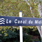 Au XVIIe sicle, la ville de Revel se retrouve crible de dettes. Pierre Paul Riquet, banquier et homme d'affaires, prte une grosse somme d'argent  la ville. C'est comme cela qu'il se fait connatre. Il a le projet de se faire rejoindre l'ocan et la Mditerrane par la construction d'un canal, que nous connaissons aujourd'hui comme le canal du Midi. Connu sous le nom de Jean Fabre  Revel, il fait la connaissance de certains habitants de Revel, qui connaissent bien le territoire. Pierre Camas, fontainier de la ville, lui donne l'ide de d'amnager une rserve d'eau (aujourd'hui le lac de Saint-Ferrol) en se servant des eaux de la rigole de la montagne Noire, tout cela dans le but d'alimenter ce fameux canal. Avec l'approbation du roi, les travaux dbutent en 1667 et sachveront en 1680.